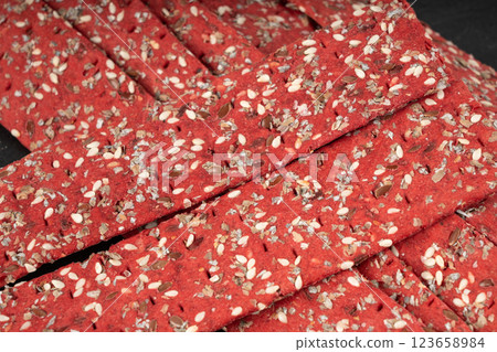 Beetroot crackers, thin rusk beet root bread, red diet multigrain crispbread, various seeds Beetroot crackers, thin rusk beet root bread, red diet multigrain crispbread, various seeds 123658984