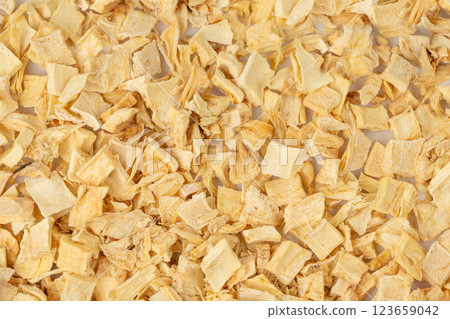 Dry parsley root texture background, dried diced celery cubes pattern, small liquorice pileces banner Dry parsley root texture background, dried diced celery cubes pattern, small liquorice pileces banner 123659042