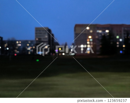 Blurred abstract background view of apartment buildings high-rise buildings at night. Colorful bokeh from view of apartment buildings high-rise buildings blurred in highway. Urban motion concept 123659237