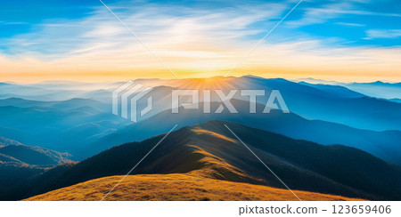 Breathtaking sunrise over rolling mountains, showcasing vibrant colors and serene landscape. golden rays illuminate peaks, creating peaceful atmosphere 123659406