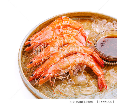 Freshly cooked shrimp served over ice with dipping sauce Freshly cooked shrimp served over ice with dipping sauce 123660001