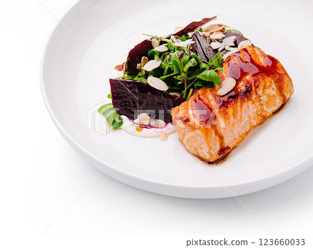 Salmon dish with beetroot and salad on a white plate 123660033