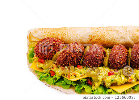 Tasty sandwich filled with falafel, cheese, and fresh toppings Tasty sandwich filled with falafel, cheese, and fresh toppings 123660055
