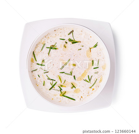 Creamy dressing with herbs and spices in a white bowl 123660144
