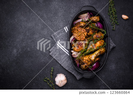 Baked or roasted chicken legs 123660864