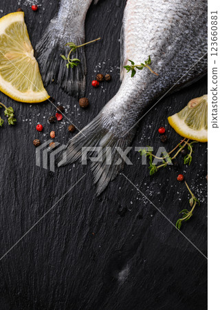 Raw sea bream or dorado fish with lemon Raw sea bream or dorado fish with lemon 123660881
