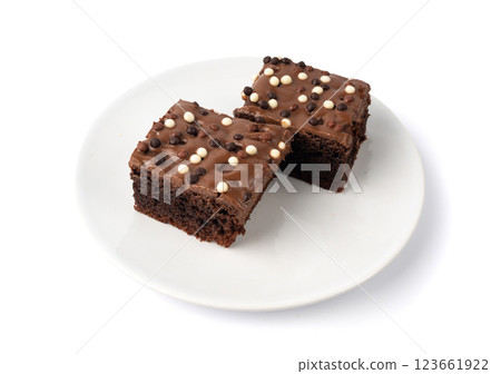 Chocolate brownie cake sprinkled with white and dark balls, classic birthday brownie square piece Chocolate brownie cake sprinkled with white and dark balls, classic birthday brownie square piece 123661922