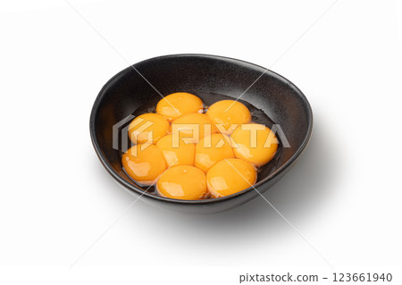 Egg Yolks in Bowl, Fresh Chicken Egg Yolk Separated from Whites for Cooking Recipe, Organic Yolks Top View Egg Yolks in Bowl, Fresh Chicken Egg Yolk Separated from Whites for Cooking Recipe, Organic Yolks Top View 123661940
