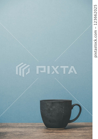A mug on a wooden desk 123662025