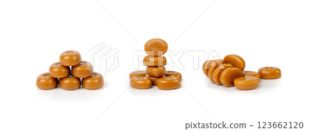 Caramel candies isolated, toffee caramel, round hard milk confectionery, brown sugar candies, small sweets 123662120