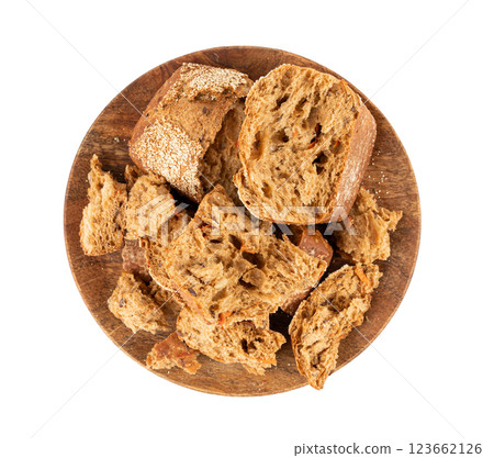Broken wheat brown bread pieces isolated, fitness pumpkin carrot buns with seeds, cereal bread Broken wheat brown bread pieces isolated, fitness pumpkin carrot buns with seeds, cereal bread 123662126