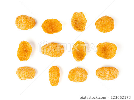 Hummus chickpea chips, chick pea crisps pile, healthy orange snack, fried legume crunchies 123662173