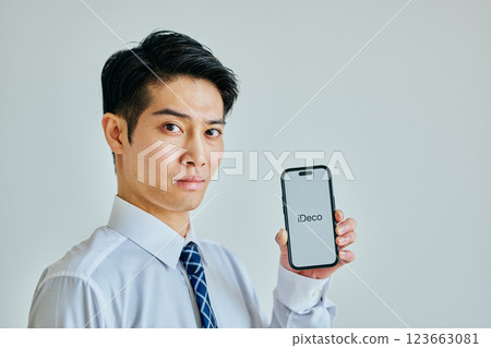 Young man in his 20s with a smartphone iDeCo Young man in his 20s with a smartphone iDeCo 123663081