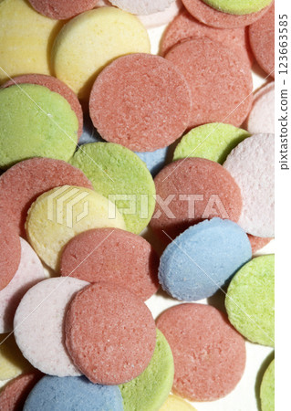 Close up of sugar paper confetti circle spots and colour dots on white background 123663585