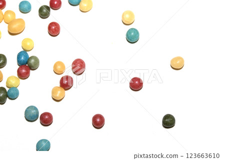 Close up of round ball sugar ice cream cake decorations on a white background Close up of round ball sugar ice cream cake decorations on a white background 123663610