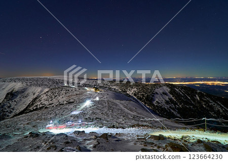 Mountaineers going along the trail during night hike, reaching the summit 123664230