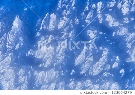 Sharp snow crystals texture macro. Shadows in nature 123664279