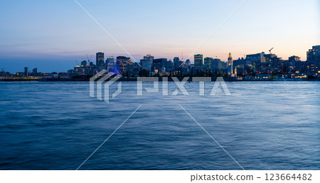 View of downtown Montreal city skyline and Saint Lawrence River at dusk, Quebec, Canada. 123664482