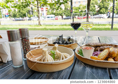 Georgian khinkali, minced meat chinkali, spicy dumplings also called dimsum, momo, jiaozi, manti Georgian khinkali, minced meat chinkali, spicy dumplings also called dimsum, momo, jiaozi, manti 123664860