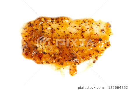 Orange jam with chili isolated, apricot chilli pepper marmalade smear, spicy fruit jelly fruity confiture 123664862