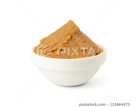 Miso paste isolated. Japanese shiro miso seasoning sauce, fermented soybean spread, brown soy cream Miso paste isolated. Japanese shiro miso seasoning sauce, fermented soybean spread, brown soy cream 123664875