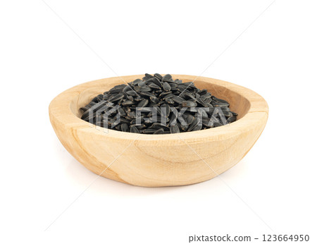 Sunflower seeds pile isolated, black oil sun flower grains group with shell, fresh edible oil seeds heap 123664950