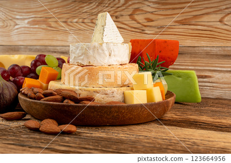 Cheese plate of color cheeses variety, yellow, white and blue cheese board, assorted dairy products 123664956