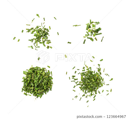 Scattered dry chive pile isolated. Dried green onion flakes, chopped dried spring onion on white Scattered dry chive pile isolated. Dried green onion flakes, chopped dried spring onion on white 123664967