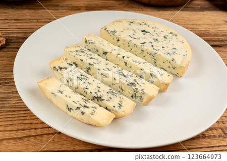 Fourme cheese, stinky french cheese, Fourme d'Ambert gourmet food, semi-hard blue cheese Fourme cheese, stinky french cheese, Fourme d'Ambert gourmet food, semi-hard blue cheese 123664973