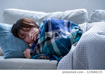 Woman shivering with a cold Woman shivering with a cold 123666135