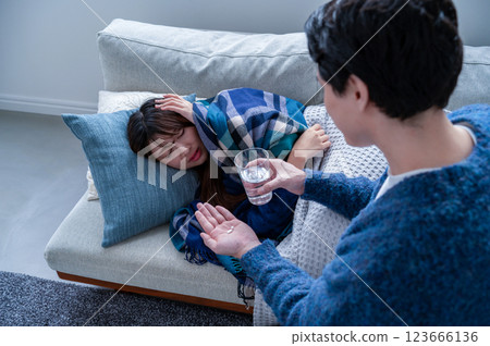 A woman who has caught a cold and is being nursed 123666136