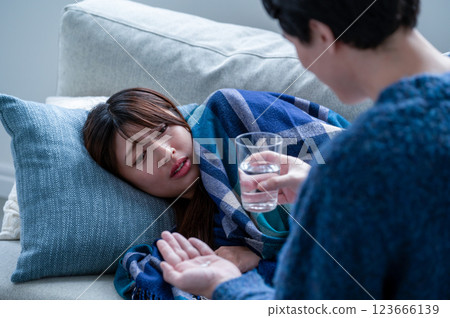 A woman who has caught a cold and is being nursed 123666139