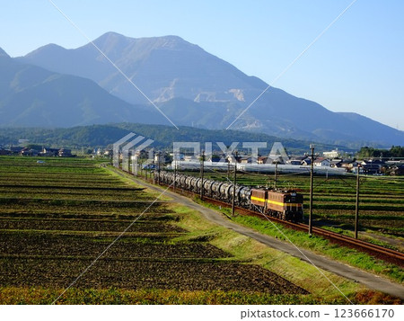 A freight train running with Mount Fujiwara in the background A freight train running with Mount Fujiwara in the background 123666170