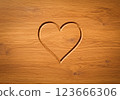 Heart carved in wood 123666306
