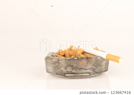 Ashtray butts cigarette on white 123667416