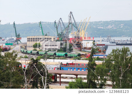 Overview of Varna port featuring various cranes, cargo ships, trains Overview of Varna port featuring various cranes, cargo ships, trains 123668123
