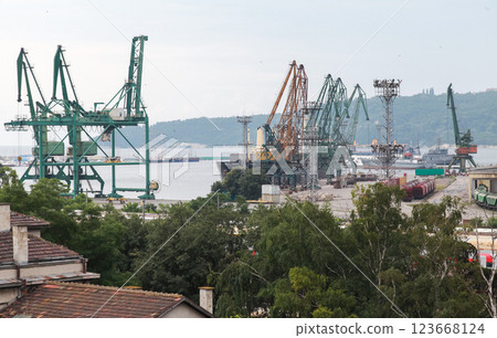 Varna industrial port featuring large cargo cranes, containers, and ships 123668124