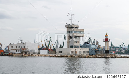 Varna, Bulgaria. Coastal view featuring a dockside with industrial buildings Varna, Bulgaria. Coastal view featuring a dockside with industrial buildings 123668127
