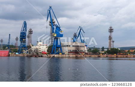 Industrial harbor scene featuring large blue cranes, Varna, Bulgaria Industrial harbor scene featuring large blue cranes, Varna, Bulgaria 123668128