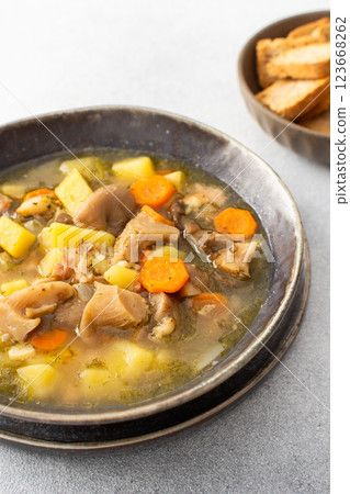 Oyster mushroom soup in plates 123668262
