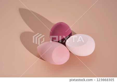 A set of makeup sponges on a pink background. A set of makeup sponges on a pink background. 123668305