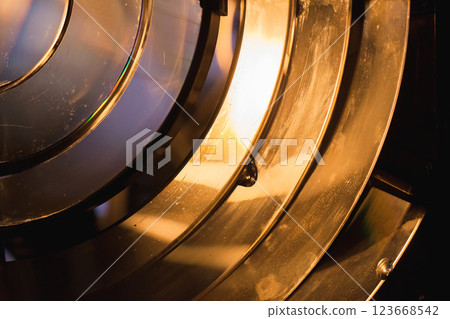 Abstract close-up photograph of a bright illuminated Fresnel lens Abstract close-up photograph of a bright illuminated Fresnel lens 123668542