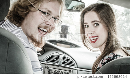 Happy man and woman in car Happy man and woman in car 123668614