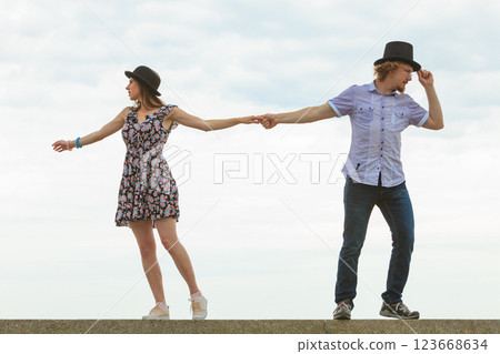 Couple pulls in different directions. 123668634