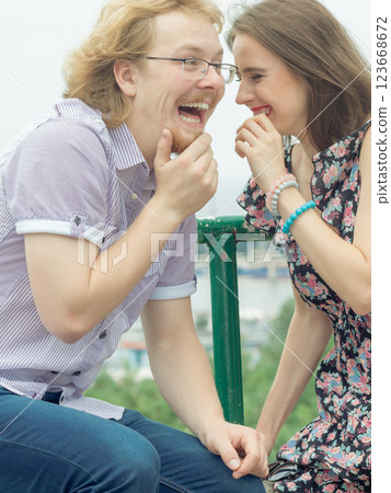 Couple gossiping during date Couple gossiping during date 123668672