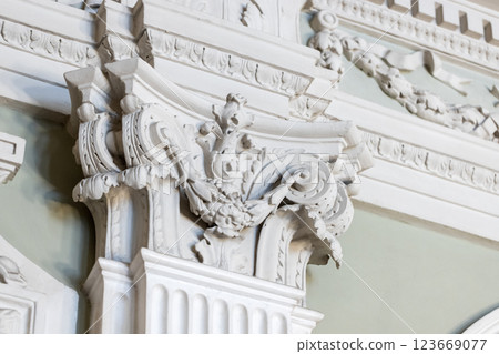Intricately designed baroque ornamentation carving on a wall 123669077
