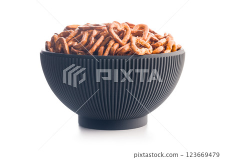Heart shaped pretzel in bowl  isolated on white background. 123669479