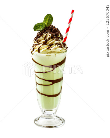 Mint Chocolate Chip milkshake transparent PNG, isolated background. Whipped cream topping garnish, served in glass, striped straw, shake bar menu dessert 123670045