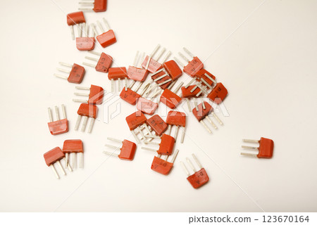 Old transistors on a white background. Electronic elements. 123670164