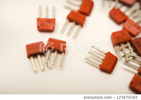 Old transistors on a white background. Electronic elements. 123670165